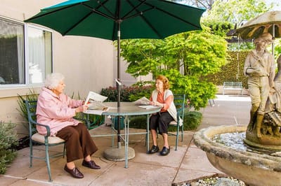 Two residents enjoying a quiet moment outside