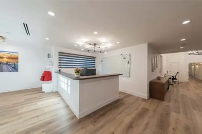 Bright reception area with wooden flooring and modern decor