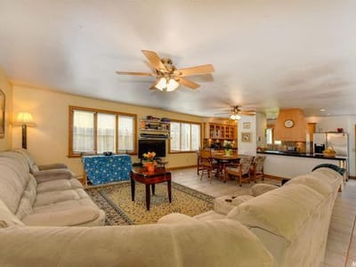 Bright common area with seating and dining space