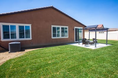 Outdoor space with seating and grassy area