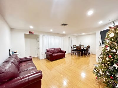 Bright common area with seating and a dining table