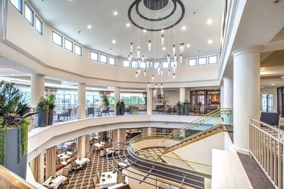 Bright and spacious interior common area with chandeliers