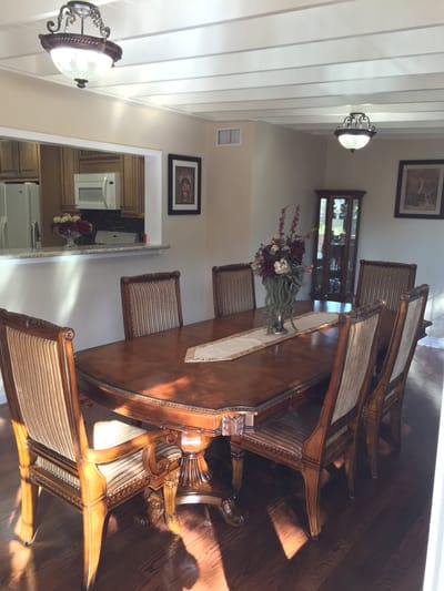 Bright dining room with wooden table and chairs