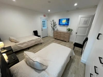 Brightly lit shared resident room with two beds