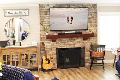 Cozy common area with warm decor and TV