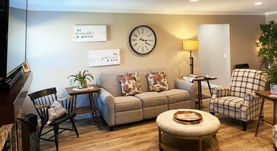 Cozy common area with seating and clock