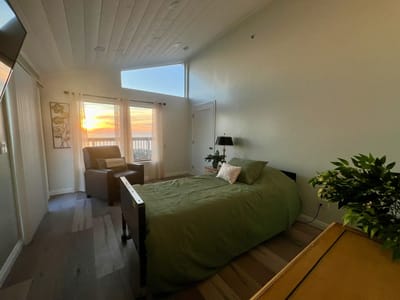 A cozy resident room with a sunset view