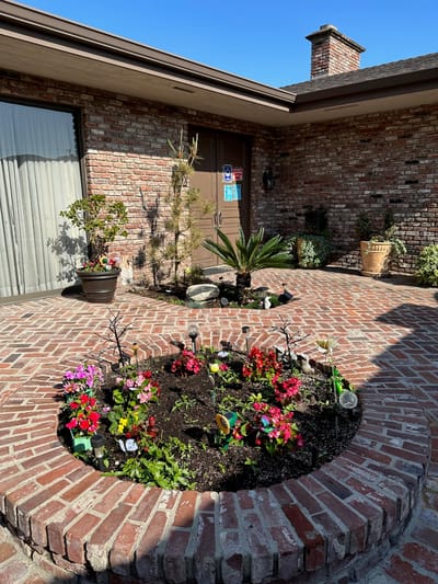 Flower garden in a brick outdoor area