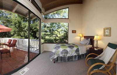 A cozy resident room with patio access