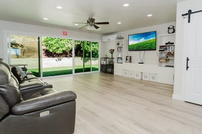 Bright common area with seating and large windows