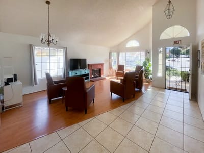 Bright common area with seating and large windows