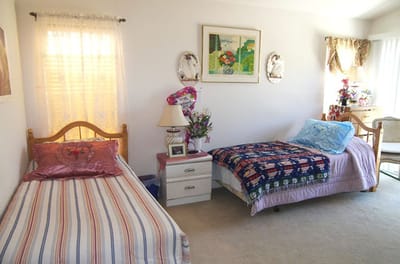 Cozy resident room with beds and decor
