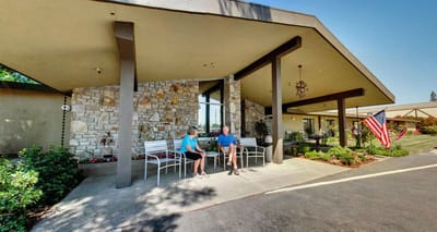 Residents enjoying the outdoor seating area at Piner's Guest Home