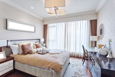 A tastefully decorated bedroom in a senior living facility