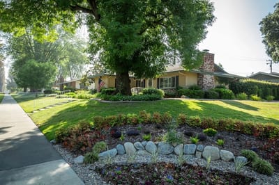 Exterior view of the Plymouth Village building with landscaping