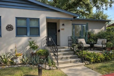 Exterior view of a charming residential building with landscaping