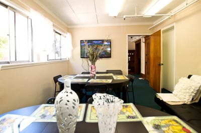 Interior view of a common area with tables and chairs