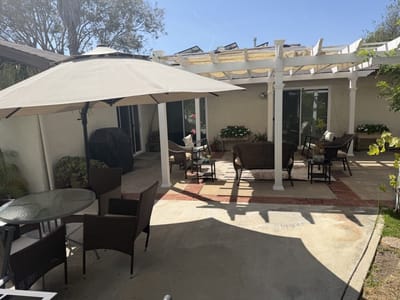 Outdoor patio with seating under a pergola