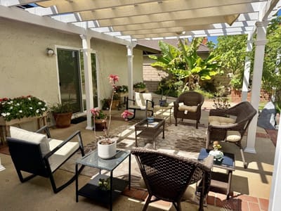 Outdoor seating area with comfortable furniture and plants