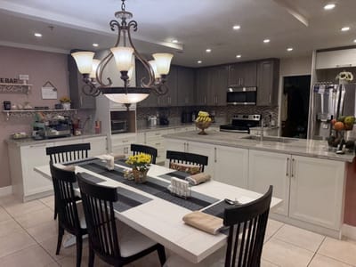 Bright dining room with a large chandelier