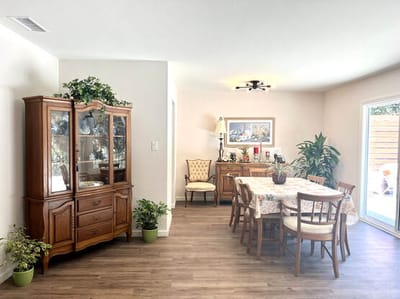 Interior dining area with wooden furniture and plants