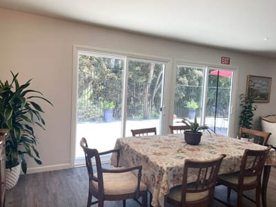 Bright dining area with access to outdoor space