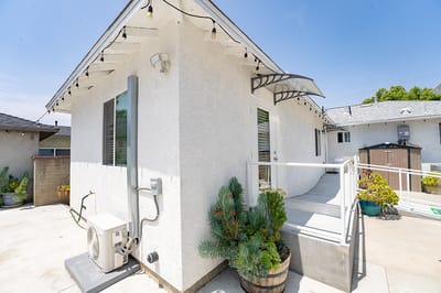 Exterior view of a well-lit assisted living facility