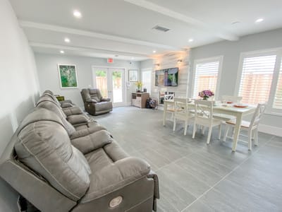 Interior view of a common area with seating and dining space
