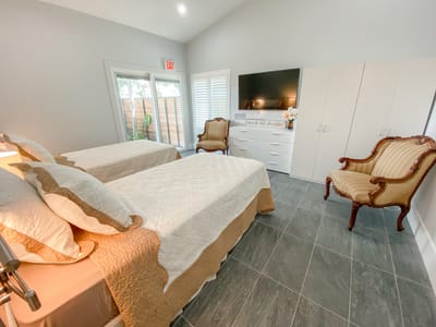 Brightly decorated twin bedroom with modern furnishings