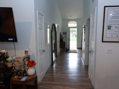 Bright hallway of a senior care facility with decorations
