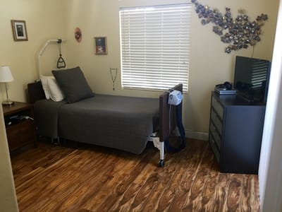Private resident room with bed and furnishings