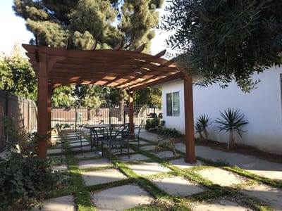 Covered outdoor seating area with tables