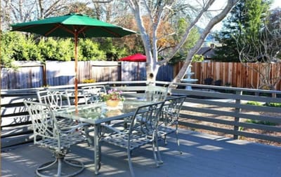 Outdoor dining area with tables and umbrellas