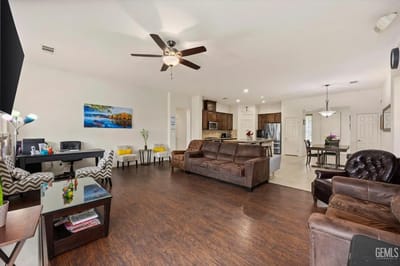 Bright common area with seating and kitchen access
