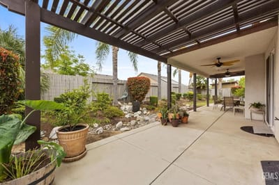 Outdoor patio area with seating and landscaping