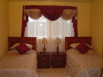 Cozy twin bedroom setup in the facility