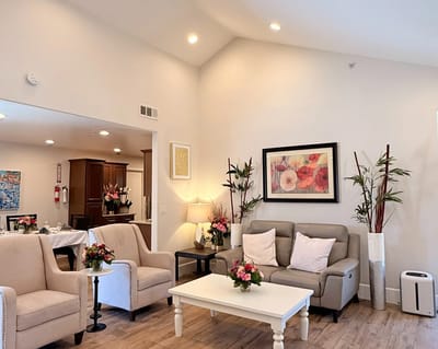 Bright common area with comfortable seating and flowers