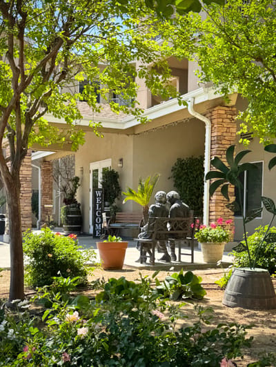 Outdoor area with welcome sign and statue