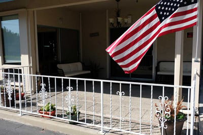 Entrance area with an American flag and seating