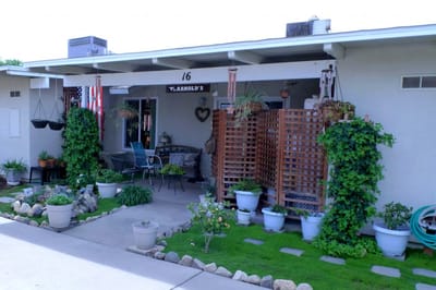 Front porch of a residential care home with plants