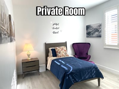 A private room with a bed and decorative elements