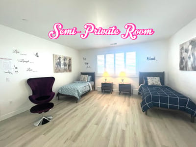 A semi-private room with two beds and decor