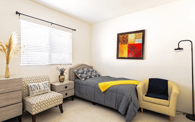 Cozy private room with a bed and decorative artwork