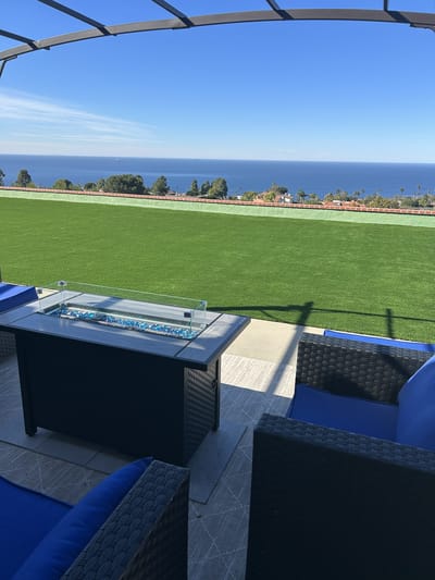 Outdoor seating area with panoramic ocean view
