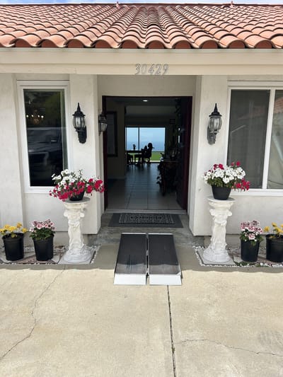 Front entrance of Sea Breeze Manor with accessibility ramp