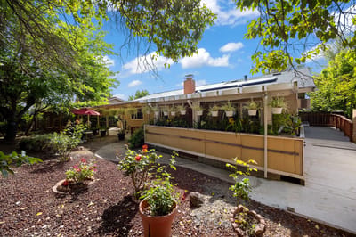 Outdoor view of Rock Oak Villa with garden and seating