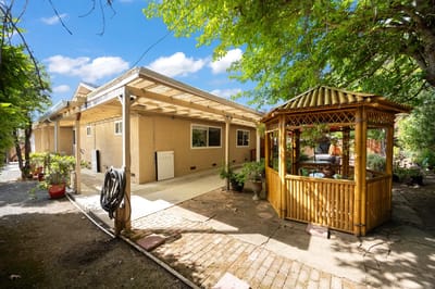 Outdoor space with a gazebo beside the building