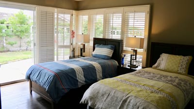 Cozy resident room with two beds and natural light
