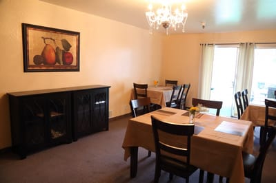 Dining area with tables and chandelier