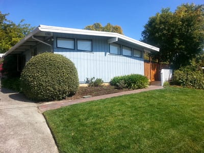 Exterior view of Shalom House with garden and lawn